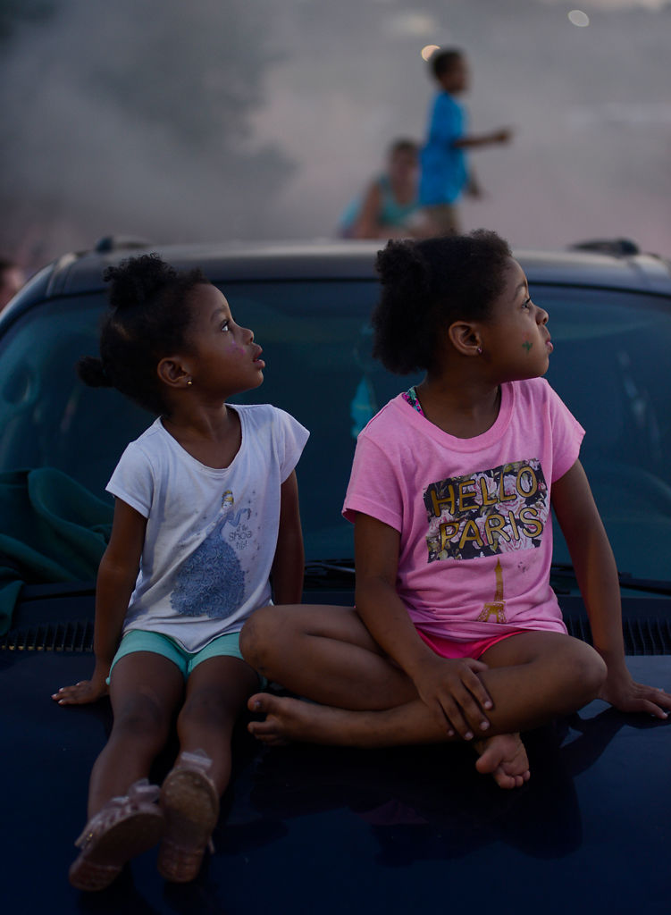 Kali Kelly, 4, and Kalley Kelly, 5, watch as the Spirit of '76 family night firework show
